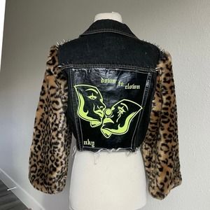 Cropped studded black denim with leopard fur sleeves